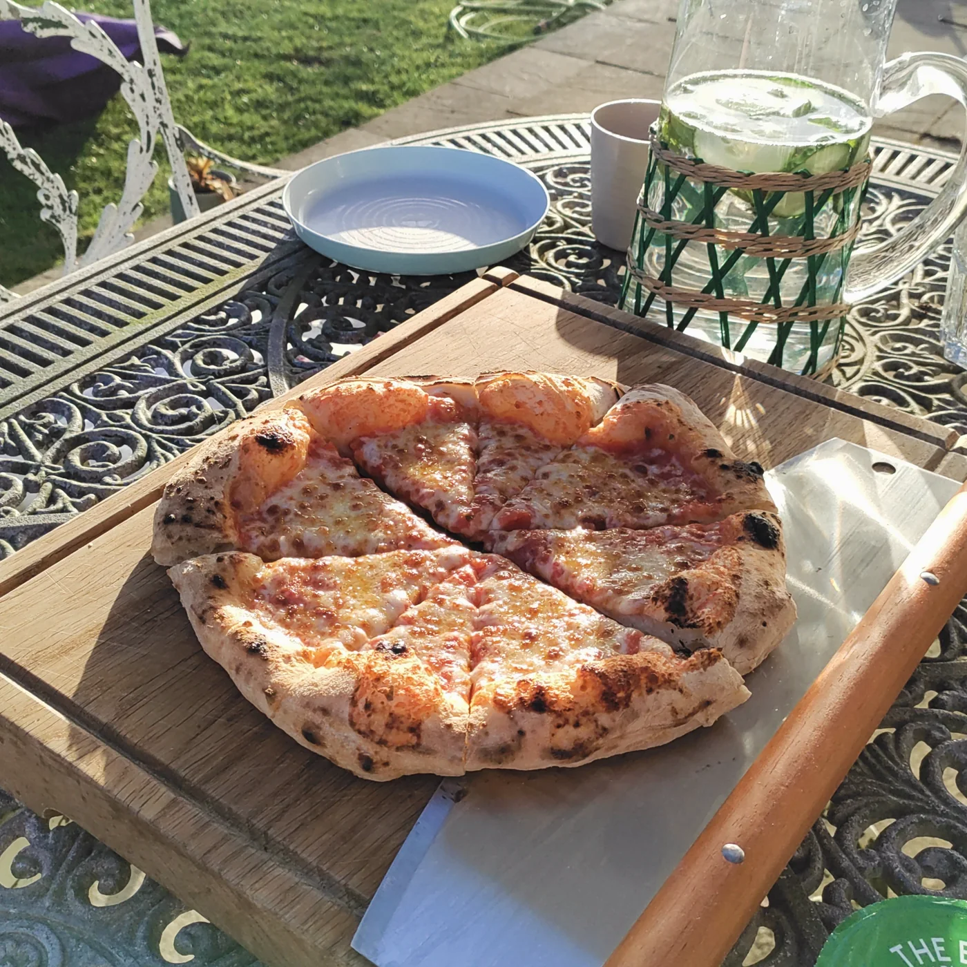 Neapolitan-style pizza with puffy cornicione and melted mozzarella